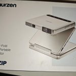 Aurzen ZIP Tri-Fold DLP Truly Mini Projector. Pocket Size. Zero-Lag Focus. One-Click Screen Mirroring. Full-Screen Mode. Type-C Fast Charging. 5.000mAh Battery. Indoor Outdoor Portable Projector.Gold photo review